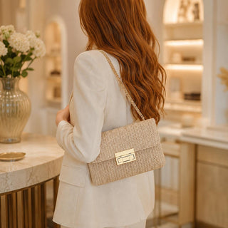Woven Boho-style crossbody shoulder bag with chain.