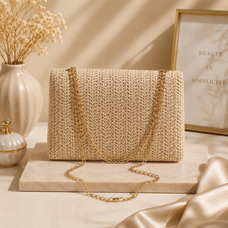 Woven Boho-style crossbody shoulder bag with chain.
