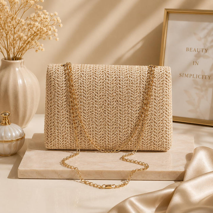 Woven Boho-style crossbody shoulder bag with chain.